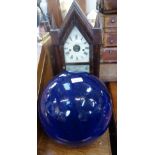 AN AMERICAN 'STEEPLE' SHELF CLOCK by Brewster & Ingrahams, 50cm high and a decorative blue glazed