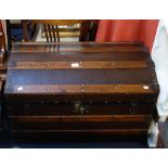 A VICTORIAN DOME TOP WOODEN BOUND CABIN TRUNK