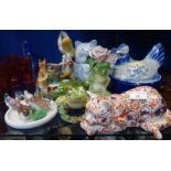 A COLLECTION OF DECORATIVE CERAMICS in the form of animals and birds, including a Naples Parakeet