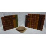 A RUN OF 19TH CENTURY LEATHER DUMMY BOOK SPINES in two parts, total 62cm long and a folding wooden