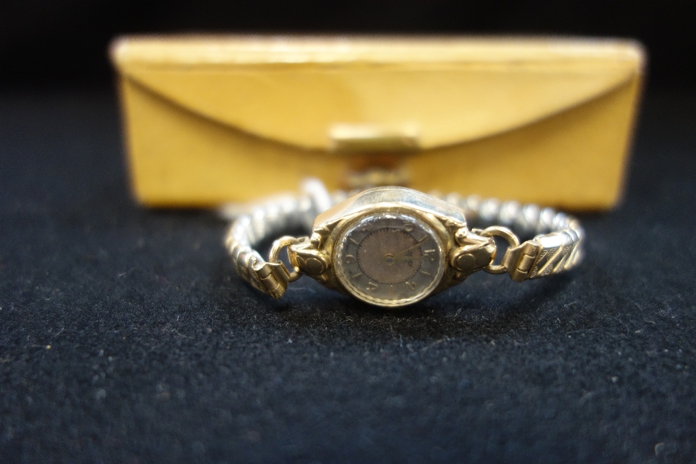 ROTARY: A Lady's unmarked yellow metal wristwatch, with expanding bracelet