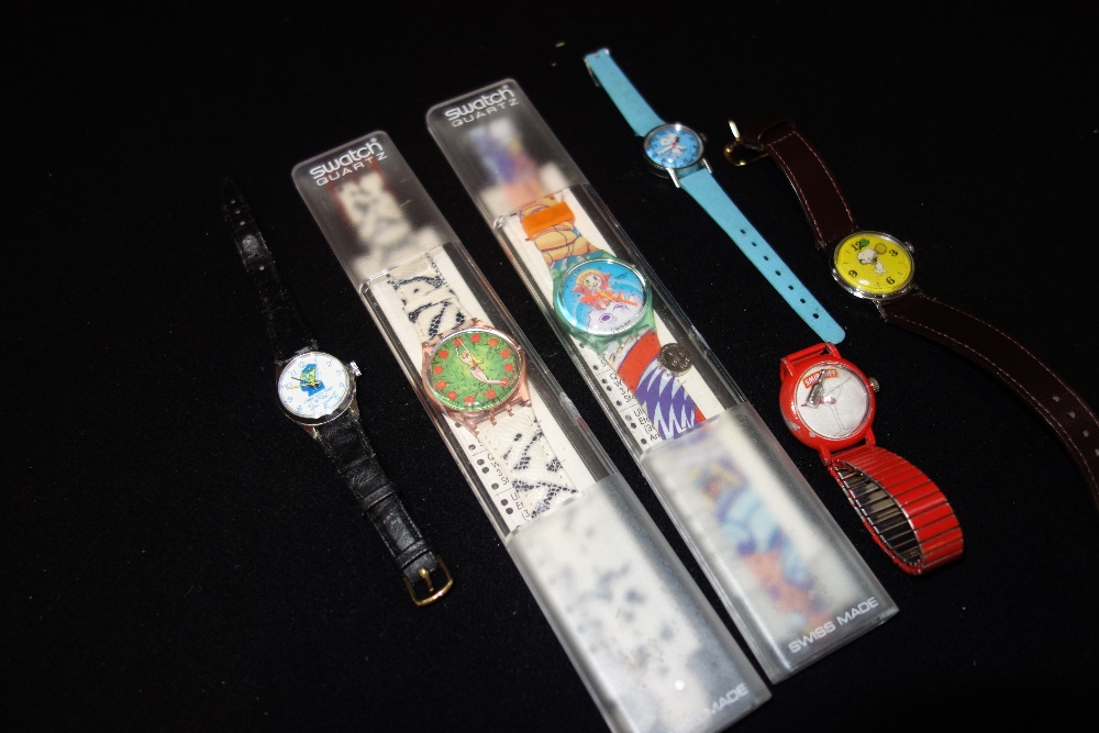 A COLLECTION OF WRISTWATCHES, to include two Snoopy dial wristwatches and two Swatch quartz