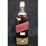 A LARGE HALF GALLON BOTTLE OF "JOHNNIE WALKER" RED LABEL WHISKY, circa early 1960s, 36.5cm high