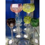 A SET OF SIX MULTI-COLOURED CUT GLASS WINE GOBLETS and four smaller glasses
