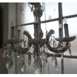 A SIX BRANCH WHITE GLASS CHANDELIER with floral decoration and cut glass drops