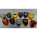 A COLLECTION OF PAINTED CAST METAL OAK MOUNTED HERALDIC SHIELDS