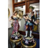 A LARGE PAIR OF 19TH CENTURY CONTINENTAL FIGURES, a musician playing a guitar and a lady with a fan,