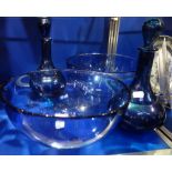 A PAIR OF BLUE GLASS DECANTERS and two similar bowls