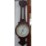 A VICTORIAN CARVED WALNUT ANEROID BAROMETER, the dial marked 'Marshall & Sons Newry'