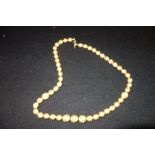 KENNETH LANE: A graduated gold bead necklace