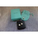 TIFFANY & CO: A pair of pearl ear studs, with 9ct yellow gold backs in a fitted pouch and