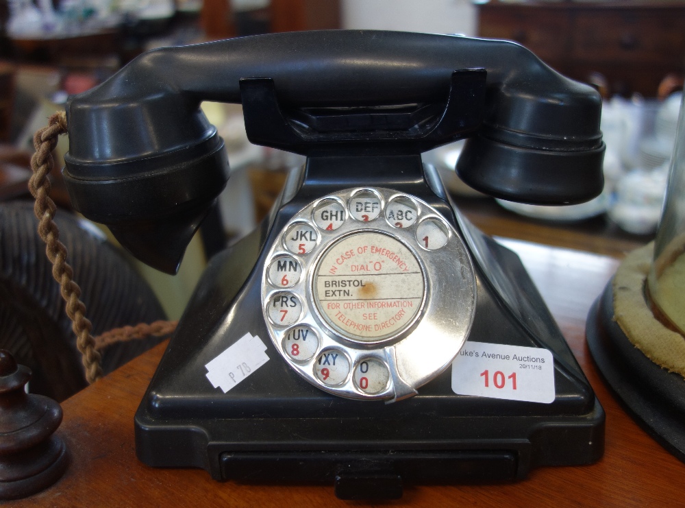A VINTAGE BAKELITE PYRAMID TELEPHONE 200 series, in black with pull-out tray