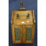 A LATE VICTORIAN WALNUT COAL SCUTTLE with embossed brass panels