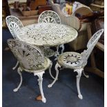 A SET OF FOUR VICTORIAN STYLE WHITE PAINTED GARDEN CHAIRS and a matching circular table