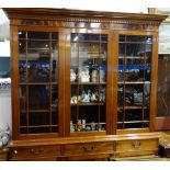 A REPRODUCTION GEORGE III STYLE MAHOGANY GLAZED BOOKCASE, by Brights, 158cm wide