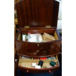 A MAHOGANY BOWFRONTED WORK TABLE with contents