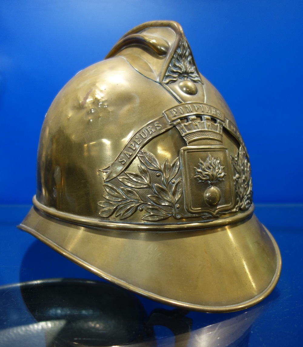 A 19TH CENTURY FRENCH BRASS FIREMAN'S HELMET from "Du Airronville" Fire Brigade , circa 1850