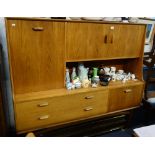 G PLAN: A mid Century modern style teak sideboard with an arrangement of cupboards and drawers,