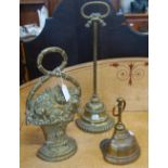 A 19TH CENTURY BRASS DOOR STOP in the form of a basket of flowers and two similar (3)