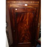 A 19TH CENTURY FLAME MAHOGANY HANGING CORNER CUPBOARD with shaped shelves and painted interior, 80cm