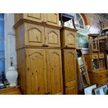 A COLLECTION OF PINE FURNITURE, including chest of drawers, wardrobes, bedside tables, cheval mirror