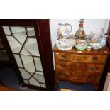 A WALNUT BOWFRONTED CHEST OF THREE DRAWERS, 61cm wide and a George III hanging glazed corner cabinet