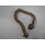 A 9CT YELLOW GOLD CHAIN LINK BRACELET with padlock clasp, c. 18gm