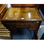A REPRODUCTION WALNUT AND CROSSBANDED LOWBOY, 68cm wide
