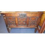 AN OAK COFFER, with carved decoration and initials F.G and dated 1705, 108 cms wide