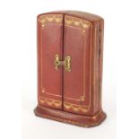 Cartier tooled leather case stamped Cartier to the reverse, 10cm high :