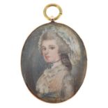 18th century oval hand painted portrait miniature onto ivory of a young lady, wearing a cap,