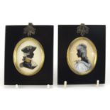 Pair of 19th century oval hand painted silhouettes by Dorothy Twitoy, one titled 'Lady with Dove',