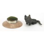 Silver mounted bisque pin cushion, together with a lead cat pin cushion, the silver mounted