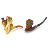 Two Meerschaum pipes including one of a nude maiden and a putti, the largest 13.5cm in length :