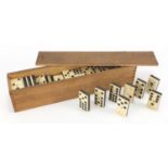 Set of twelve bone and ebony dominoes with box, each domino 5cm x 2.5cm Further condition reports