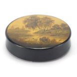 Russian lacquered snuff box, the lid hand panted with a river, indistinctly titled and inscribed