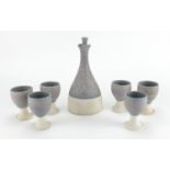 St Ives Studio pottery wine bottle and six matching goblets, impressed marks and dated 1973, the