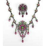 800 grade silver suffragette necklace and brooch set with pink and green stones, housed in a