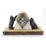Art Deco marble and onyx mantel clock, mounted with two bronzed cats, the silvered dial with