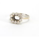 18ct gold ring set with ten diamonds, size L, approximate weight 4.3g Further condition reports