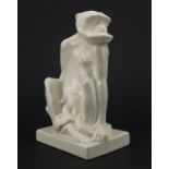 Wedgewood white glazed figure of a monkey by John Skeaping, factory marks to the base, 24cm high