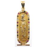 Egyptian gold pendant decorated in relief with hieroglyphics and set with colourful stones, 5.5cm in