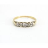 Unmarked gold Diamond five stone ring, size S, approximate weight 2.4g The Diamonds are old European