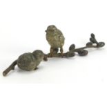 Austrian cold painted bronze group of two birds on a branch, stamped Geschutzt to the base, 20cm