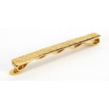 18ct gold Cartier tie slide, numbered L8766, 6cm in length, approximate weight 9.0g Further