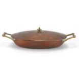 Benson copper and brass lidded tureen with twin handles, stamped Benson to the base, 37cm wide