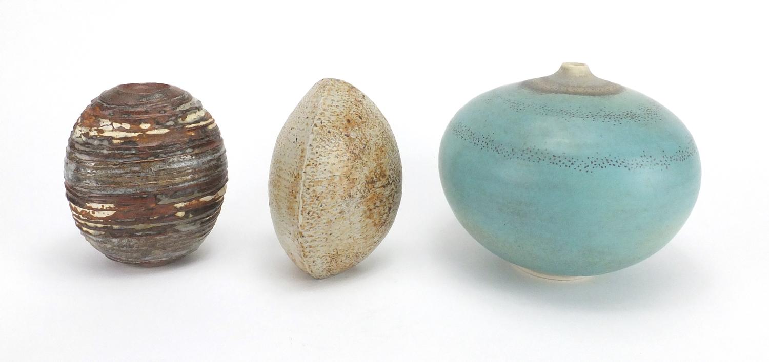Three studio pottery vases by Alan Wallwork, two of naturalistic form, incised marks to the bases,