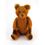 Vintage golden straw filled teddy bear with jointed limbs and beaded glass eyes, 65cm high Further