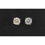 Pair of 18ct white gold diamond solitaire stud earrings The Diamonds are modern round brilliant cut,