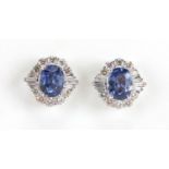 Pair of 18ct white gold Sapphire and Diamond cluster earrings Sapphire is oval faceted cut